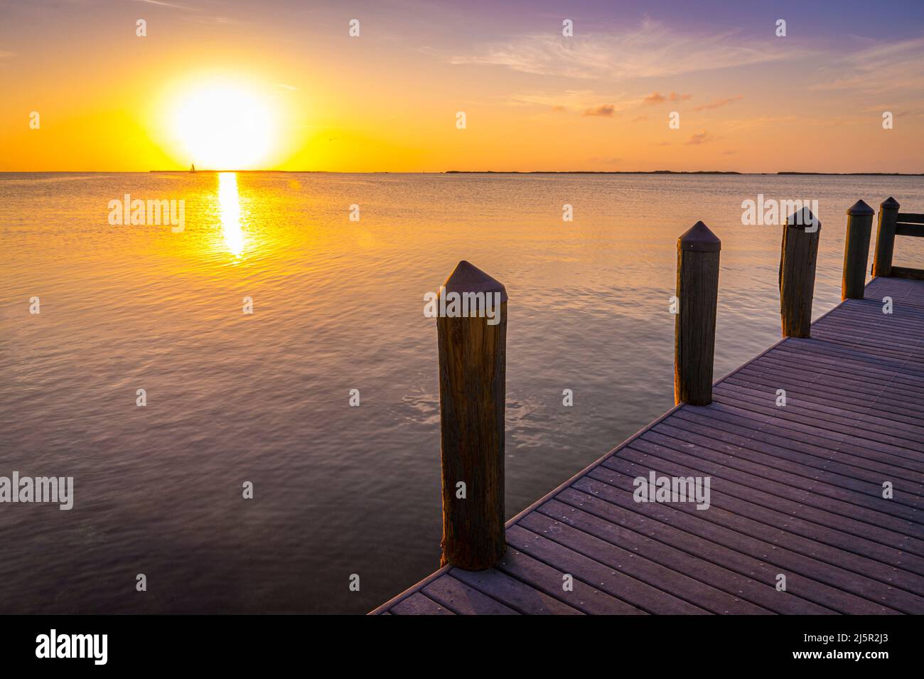Soleil et quai à quai au coucher du soleil, Key Largo Florida USA Banque D'Images