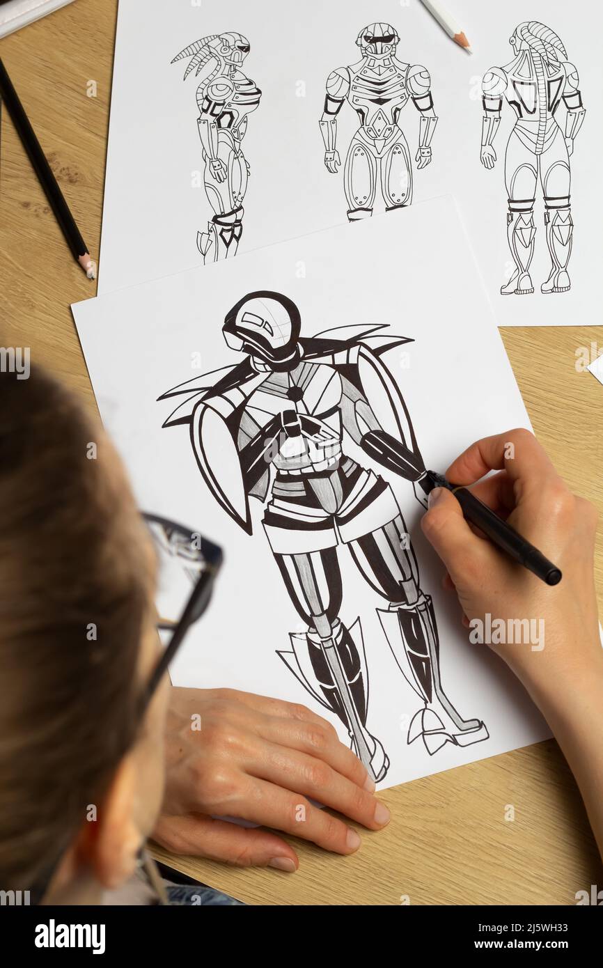Concept art. L'artiste dessine des croquis de robots cyborg sur papier. Conception de personnages pour un jeu vidéo. Création d'animation. Banque D'Images