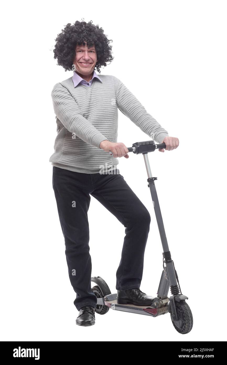 en pleine croissance. homme joyeux avec un scooter électrique. Banque D'Images