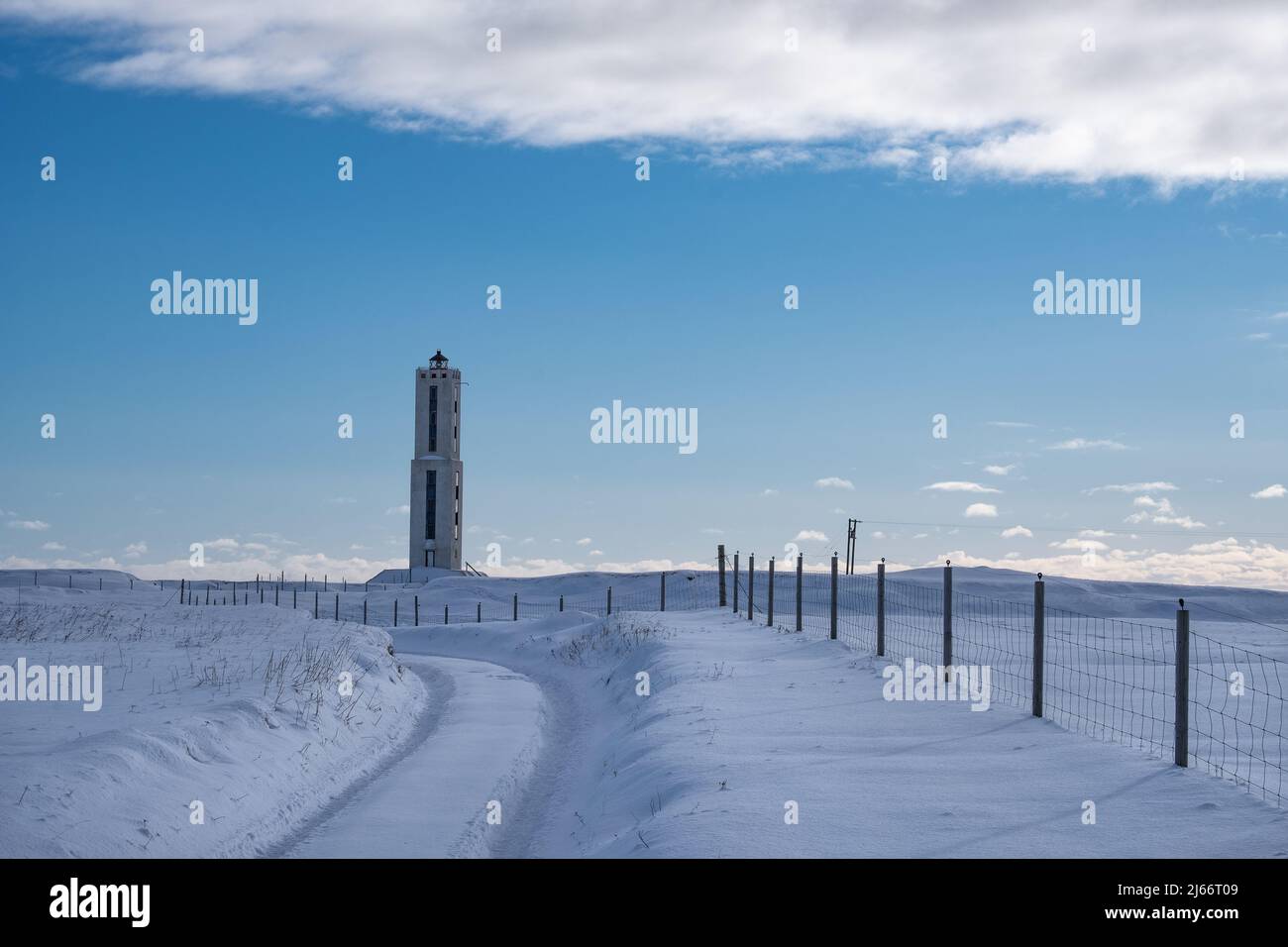Leuchtturm Knarraroshviti im Winter. Stokkseyri, Südisland. Banque D'Images