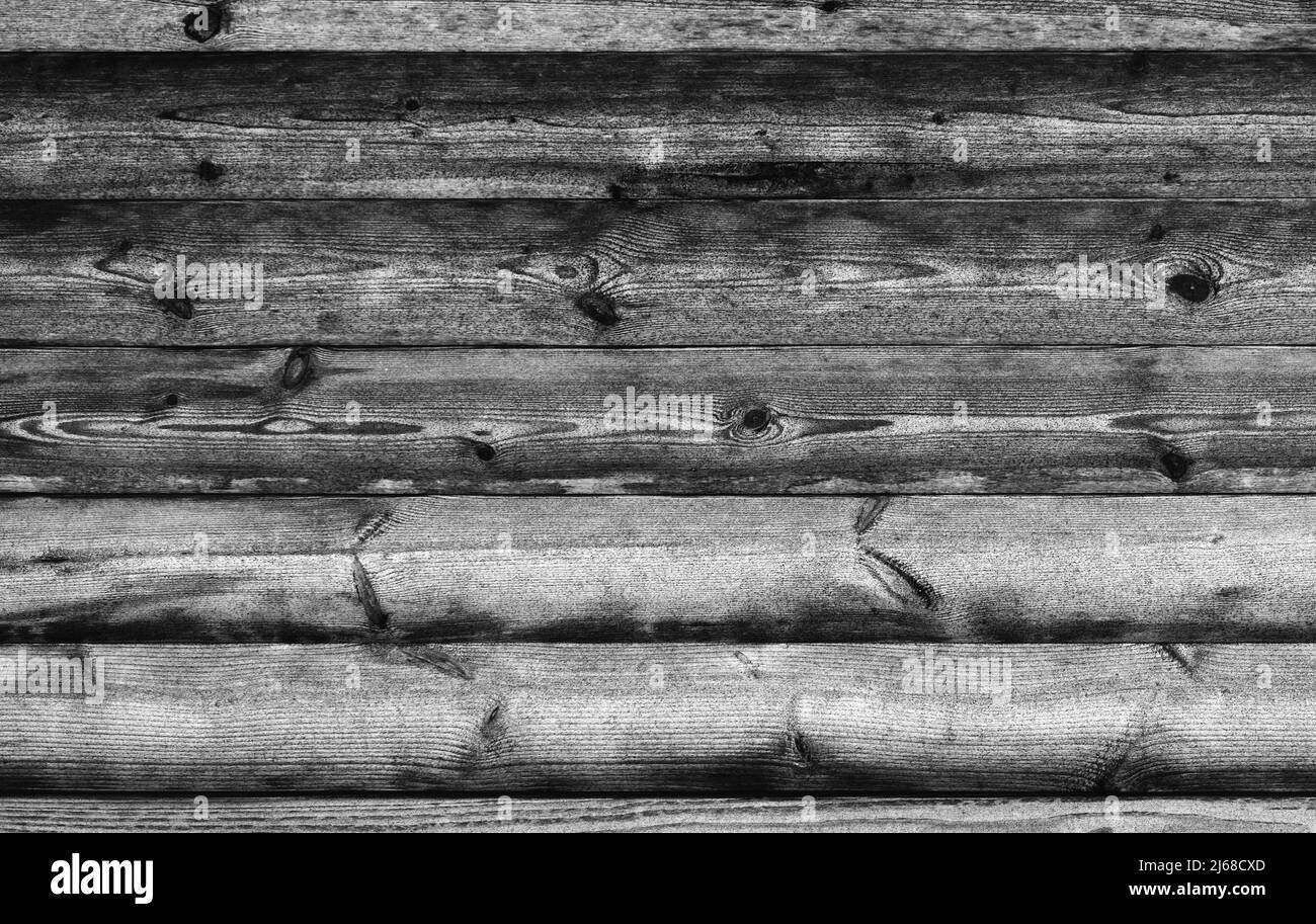 Mur en bois noir en rondins rugueux, texture photo d'arrière-plan Banque D'Images
