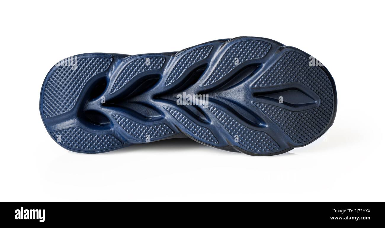 Semelle de chaussure isolée sur fond blanc. Nettoyez le fond de la semelle  rainurée bleue de la sneaker. Nouvelle semelle extérieure en caoutchouc  pour chaussures de sport. Baskets avec semelle extérieure en