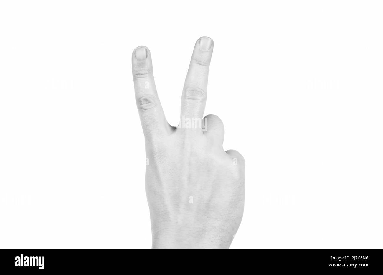 main montrant le geste de paix isolé sur fond blanc, signe de victoire Banque D'Images
