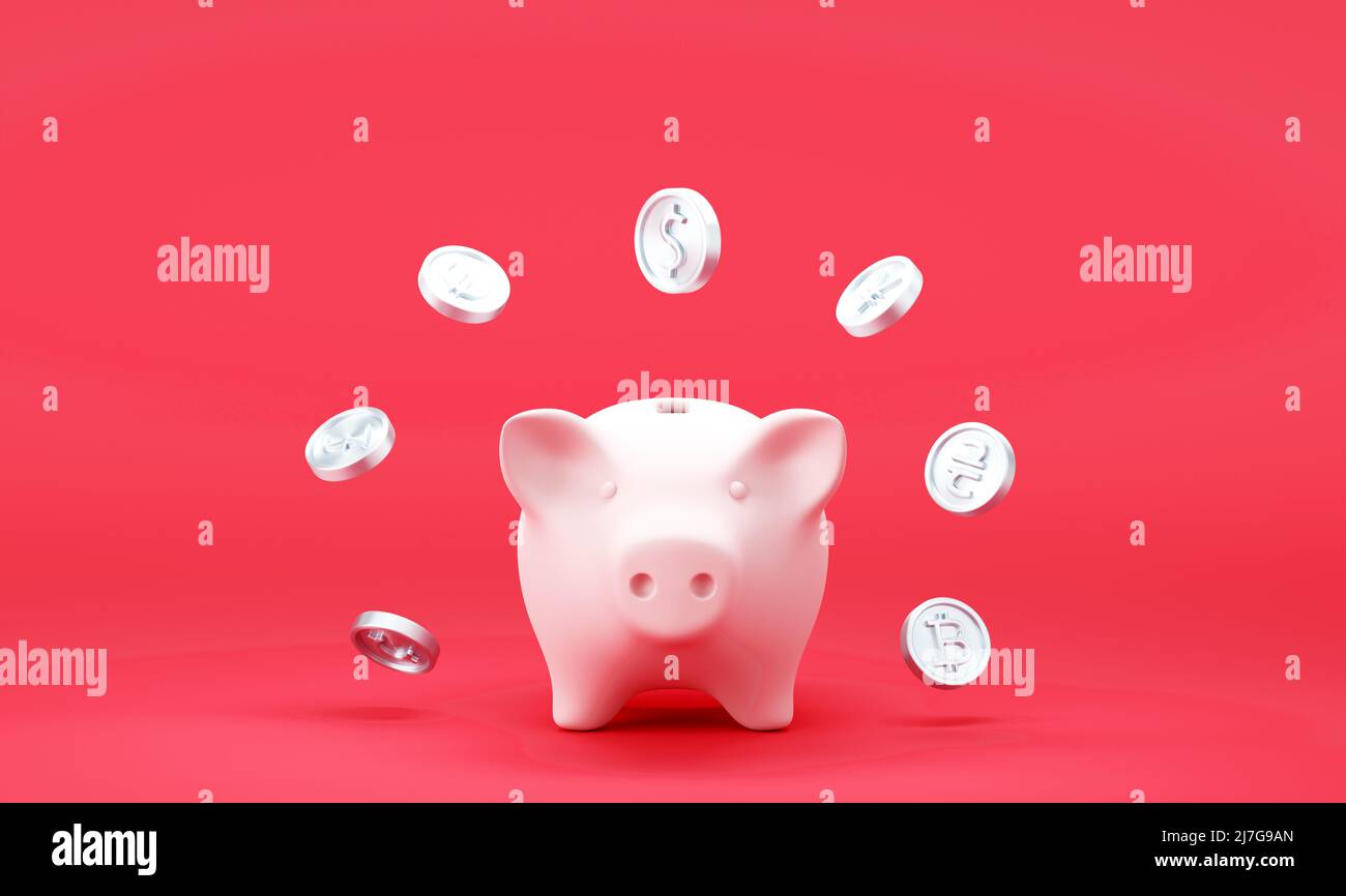 Tirelire avec des pièces de monnaie en baisse sur fond rouge Banque D'Images