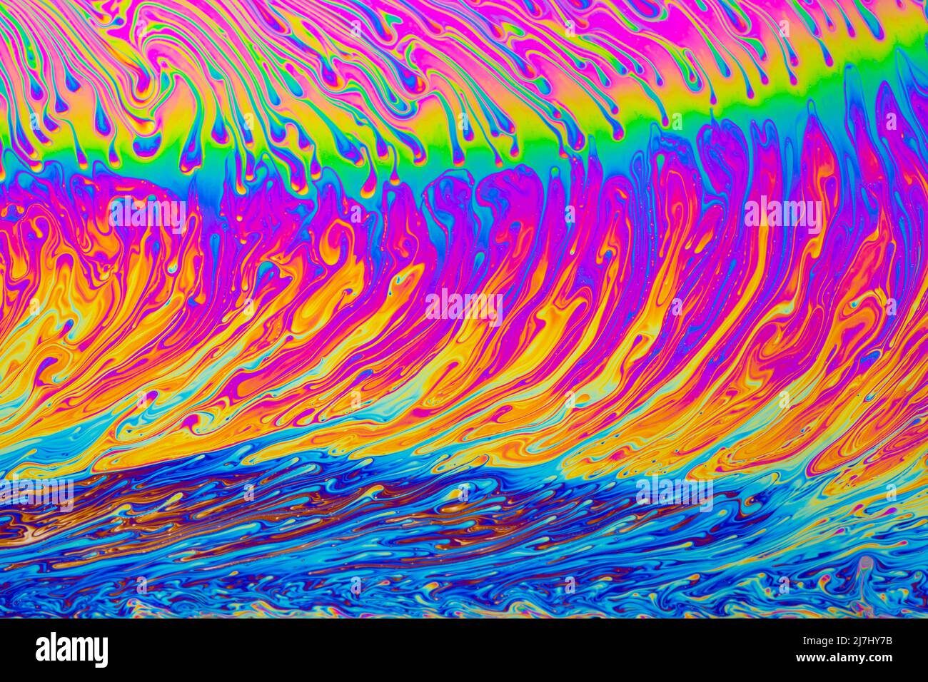 Arrière-plan psychédélique multicolore abstrait. Couleurs arc-en-ciel. Motifs d'arrière-plan. Photo macro-prise de bulles de savon Banque D'Images