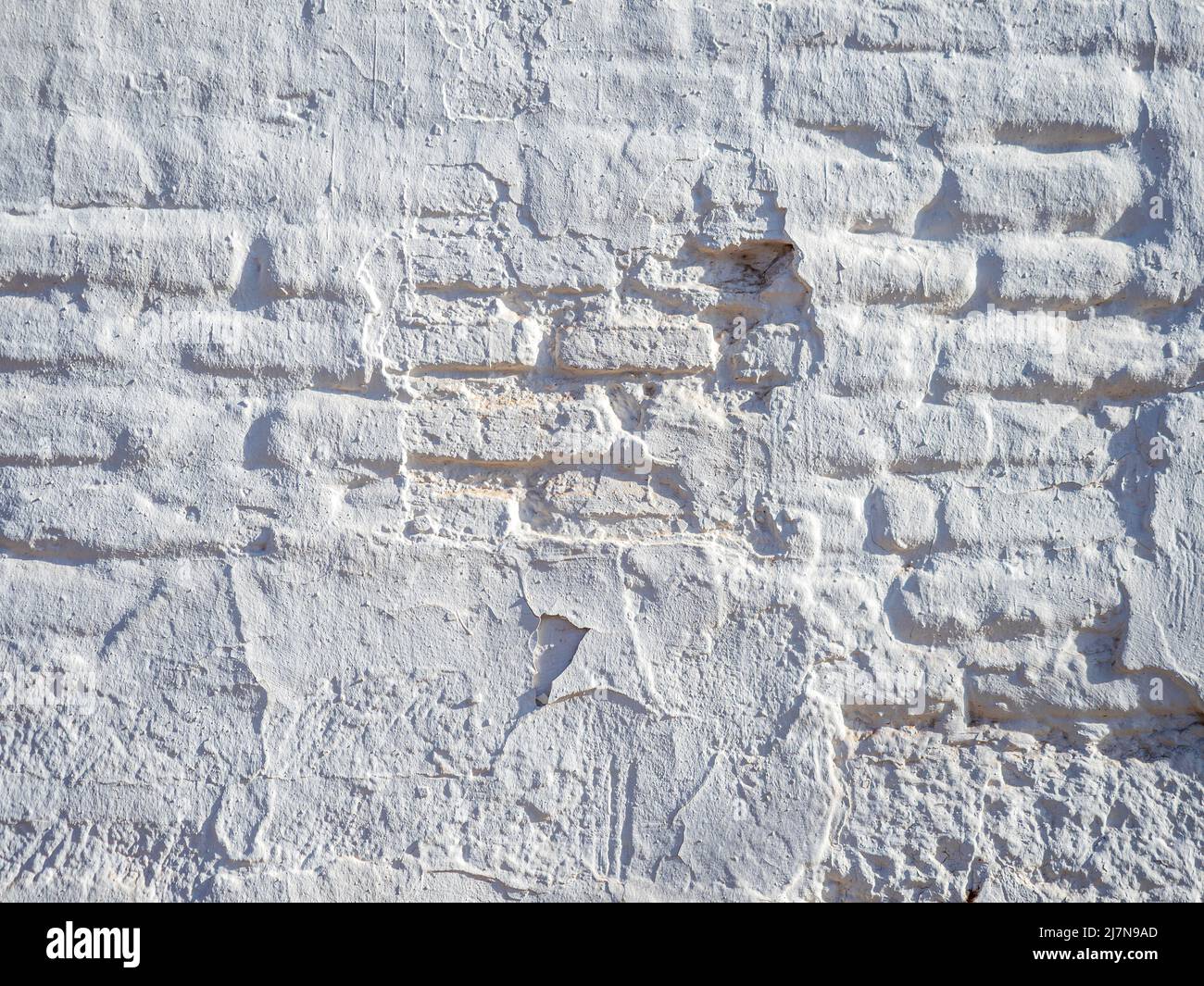 Ancienne façade de briques peinte en blanc Banque D'Images