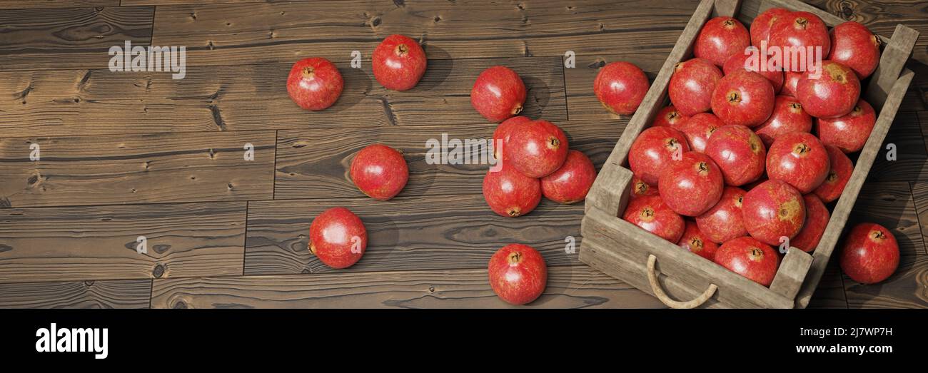 grenades, fruits juteux dans une caisse en bois sur une bannière en bois Banque D'Images
