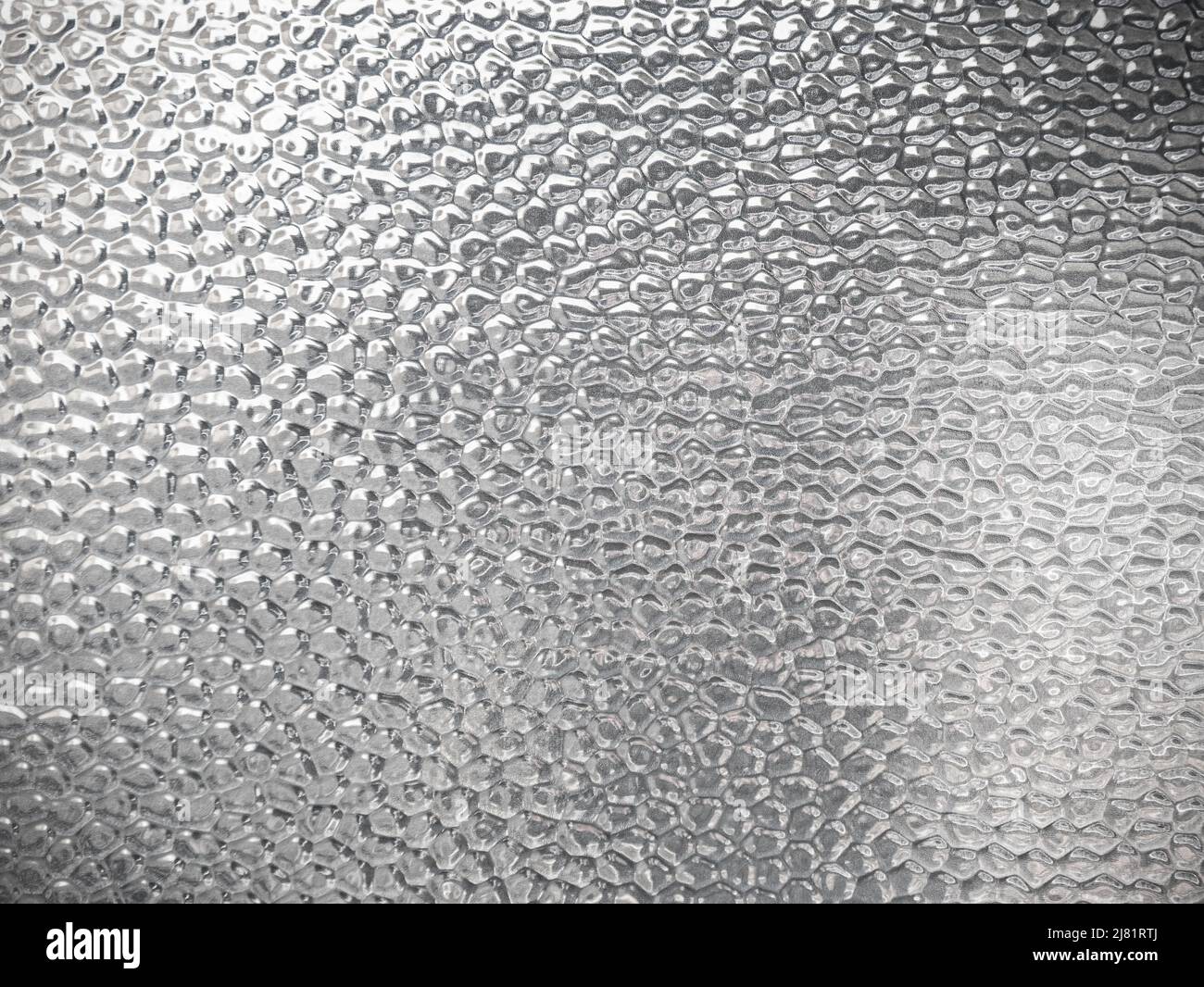 Surface en verre avec matériau texturé à bulles Banque D'Images