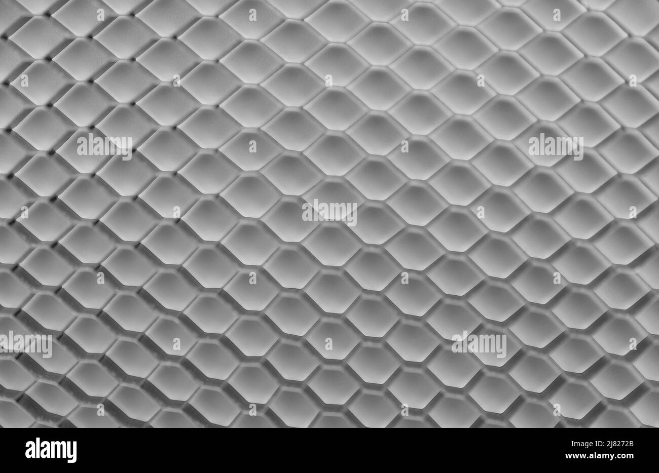 Mosaïque en nid d'abeille, fond blanc. Structure géométrique des cellules de maillage. Arrière-plan blanc abstrait avec grille hexagonale. Banque D'Images