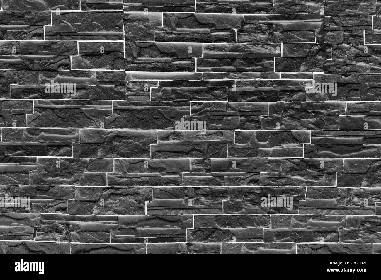Gros plan d'un vieux mur environnant dans une forteresse en pierres en noir et blanc avec vignettage Banque D'Images Gros plan d'un vieux mur environnant dans une forteresse en pierres en noir et blanc avec vignettage Banque D'Images