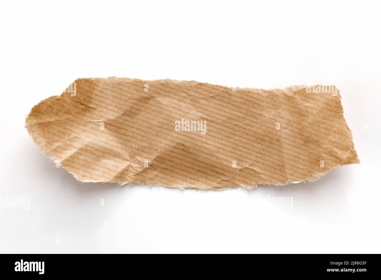 Bâton de papier recyclé sur fond blanc. Banque D'Images