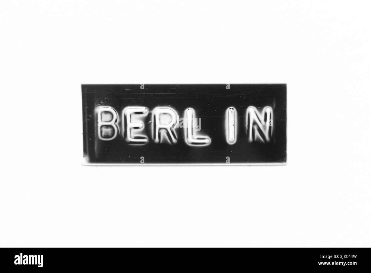 Bannière noire avec lettre en relief et mot berlin sur fond de papier blanc Banque D'Images