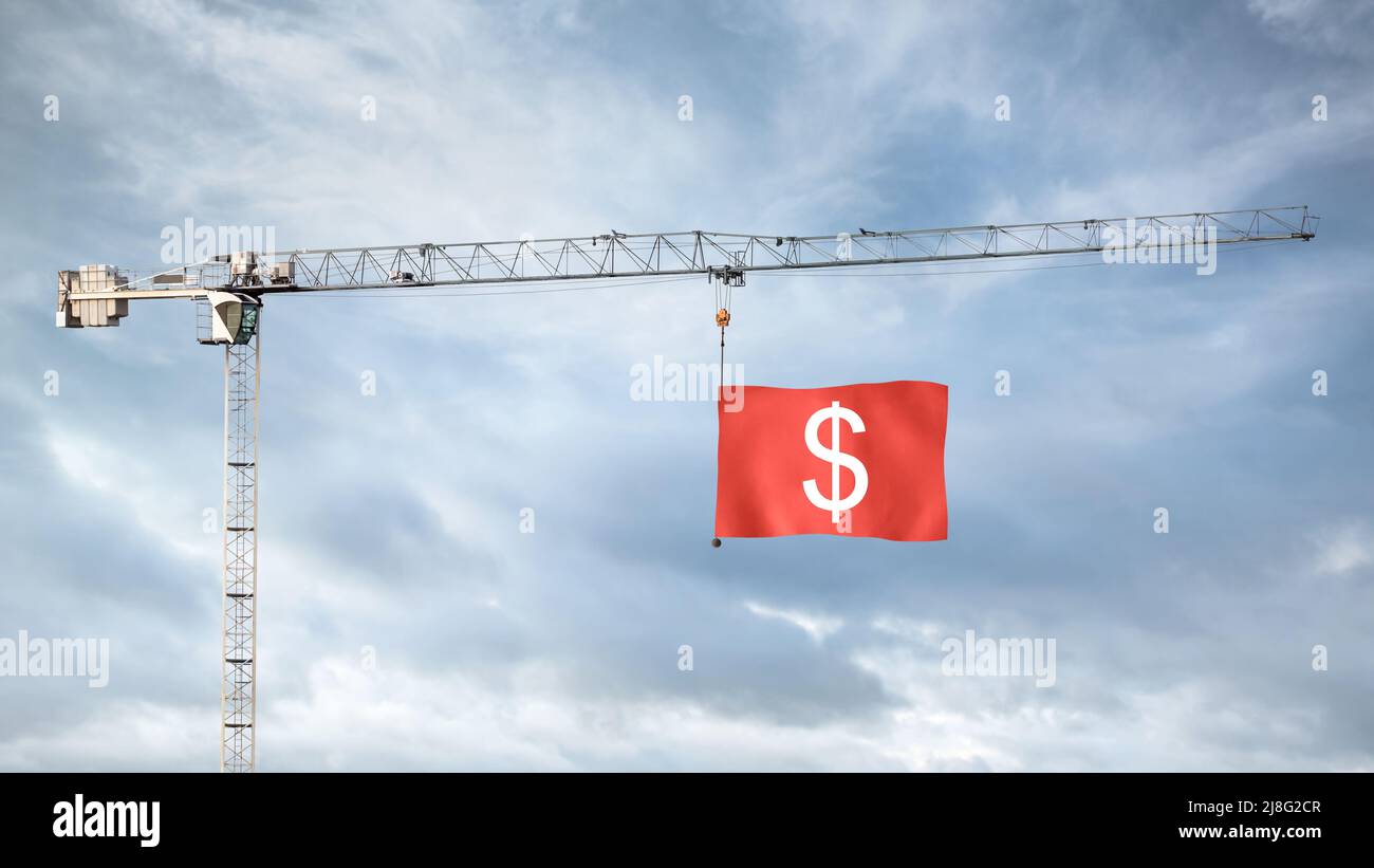 Grue de construction avec un drapeau rouge montrant un symbole Dollar Banque D'Images