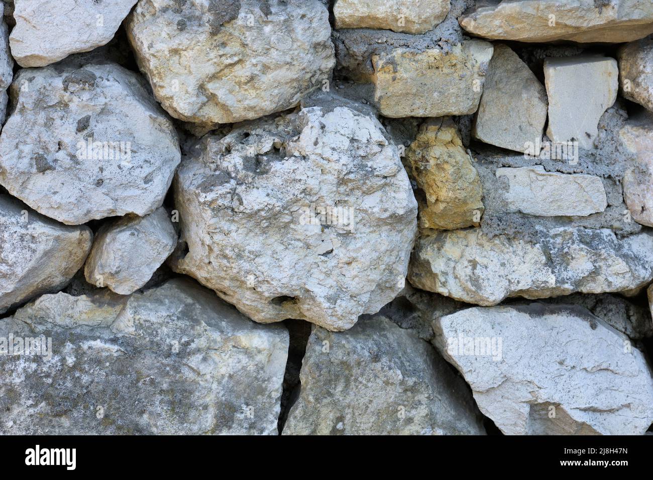 Mur en pierre calcaire avec structure rocheuse Banque D'Images