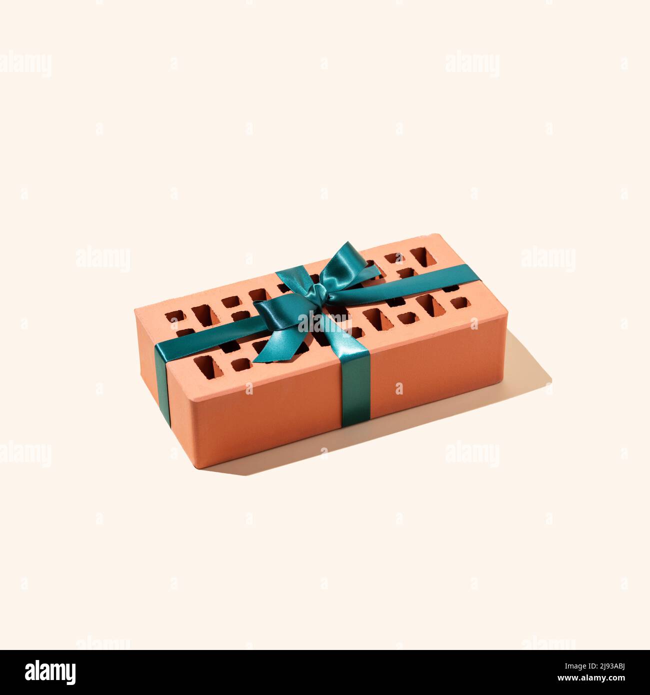 Ruban vert attaché en brique de céramique. Image conceptuelle. Banque D'Images