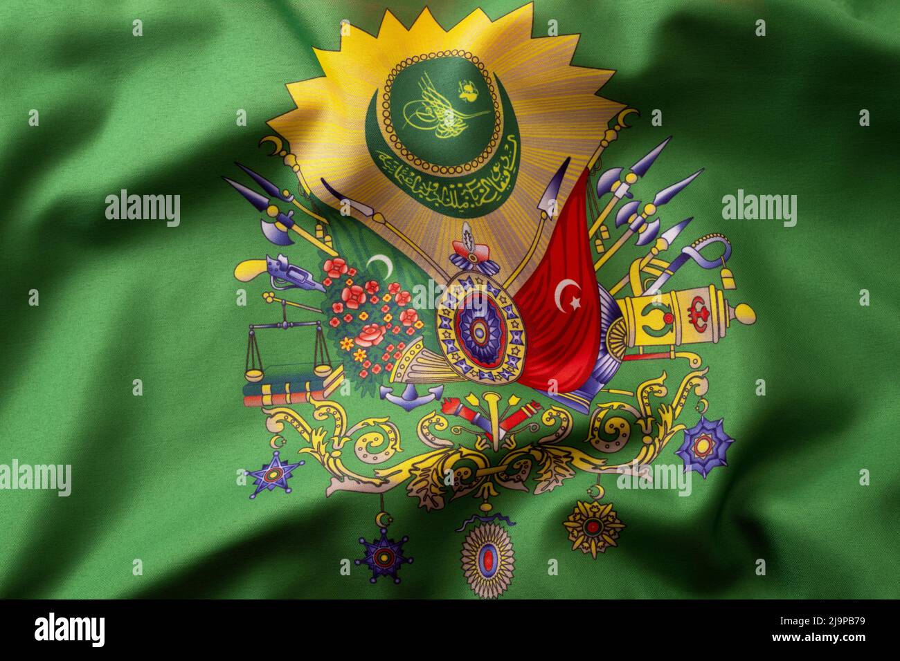 La royauté islamique, l'histoire turque et l'emblème héraldique musulman concept avec moody photographie de l'agitant drapeau textile vert de l'ancien empire pouf avec Banque D'Images