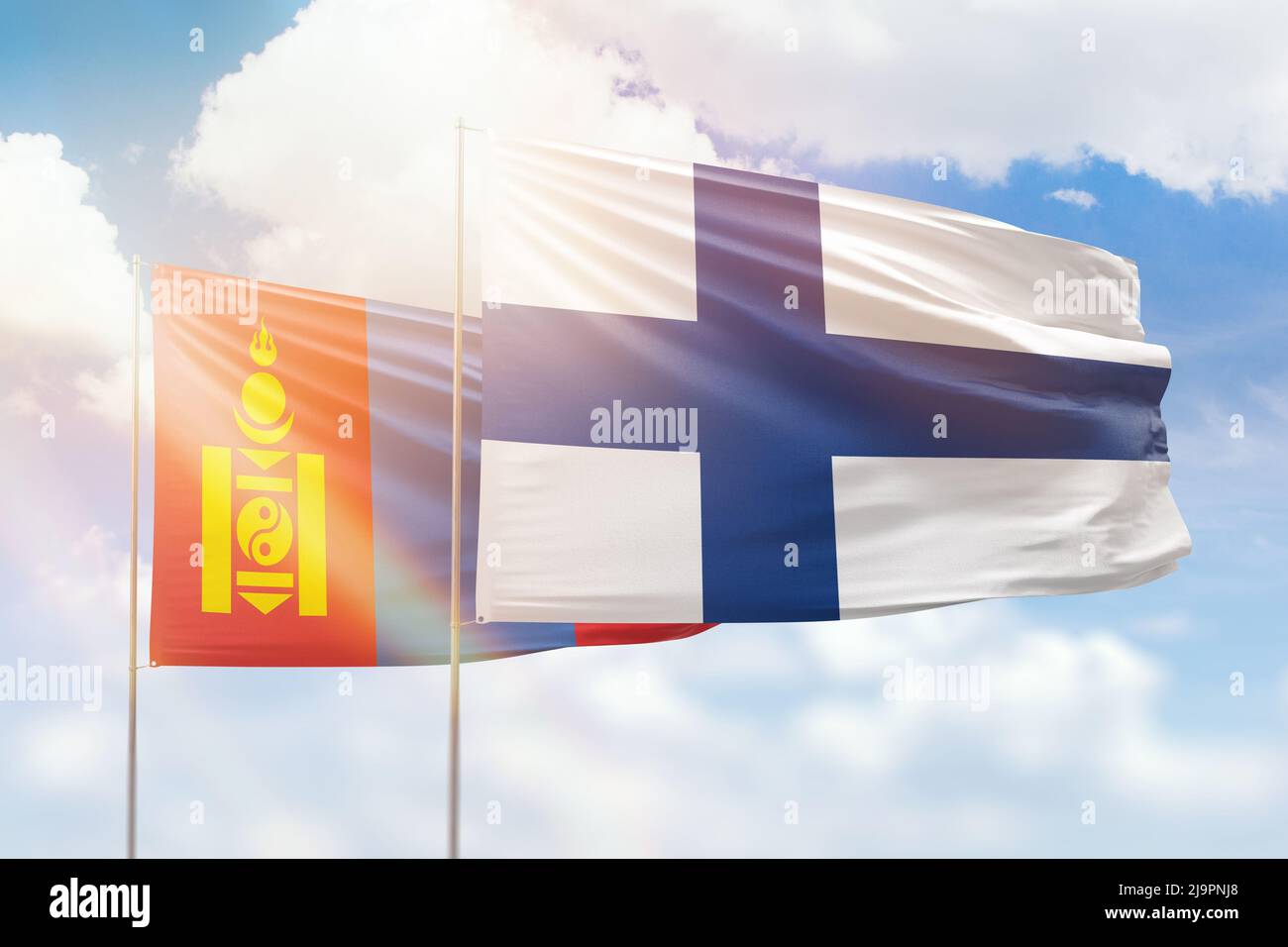 Ciel bleu ensoleillé et drapeaux de la finlande et de la mongolie Banque D'Images