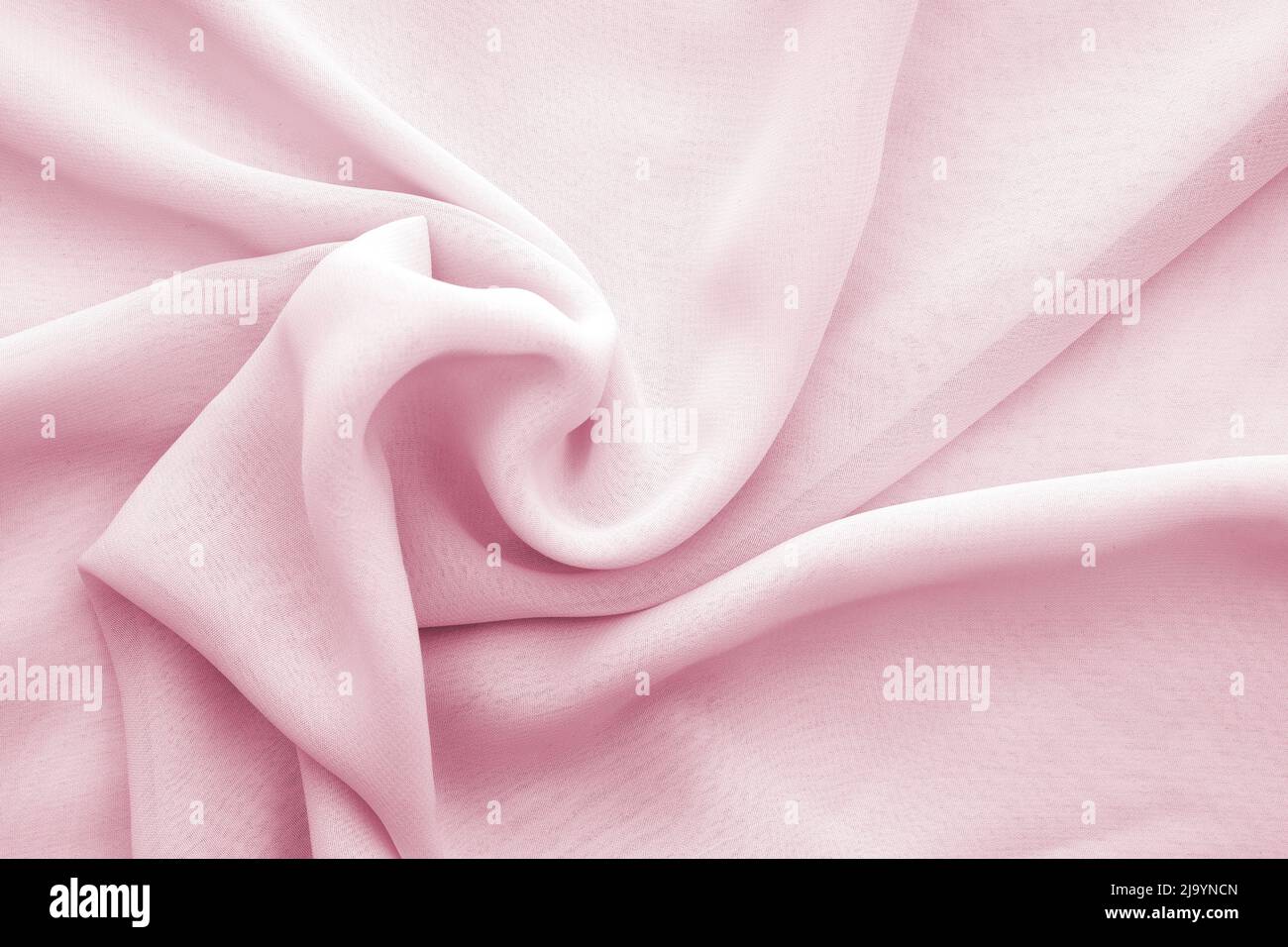 Texture ou arrière-plan de mousseline rose ondulée, mousseline transparente torsadée Banque D'Images