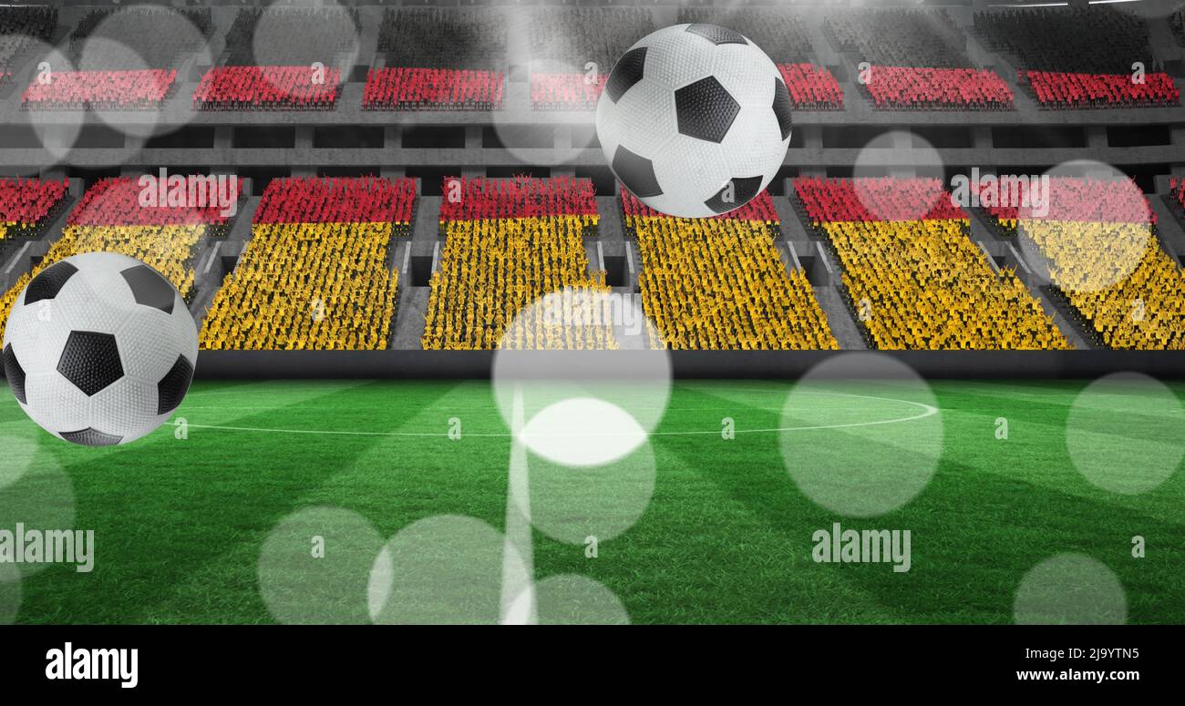 Image de ballons de football au-dessus du stade avec stands de drapeau allemand Banque D'Images
