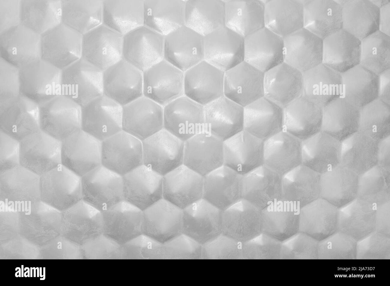 Motif nid d'abeille abstrait gris blanc fond hexagonal forme géométrique mur design intérieur moderne. Banque D'Images