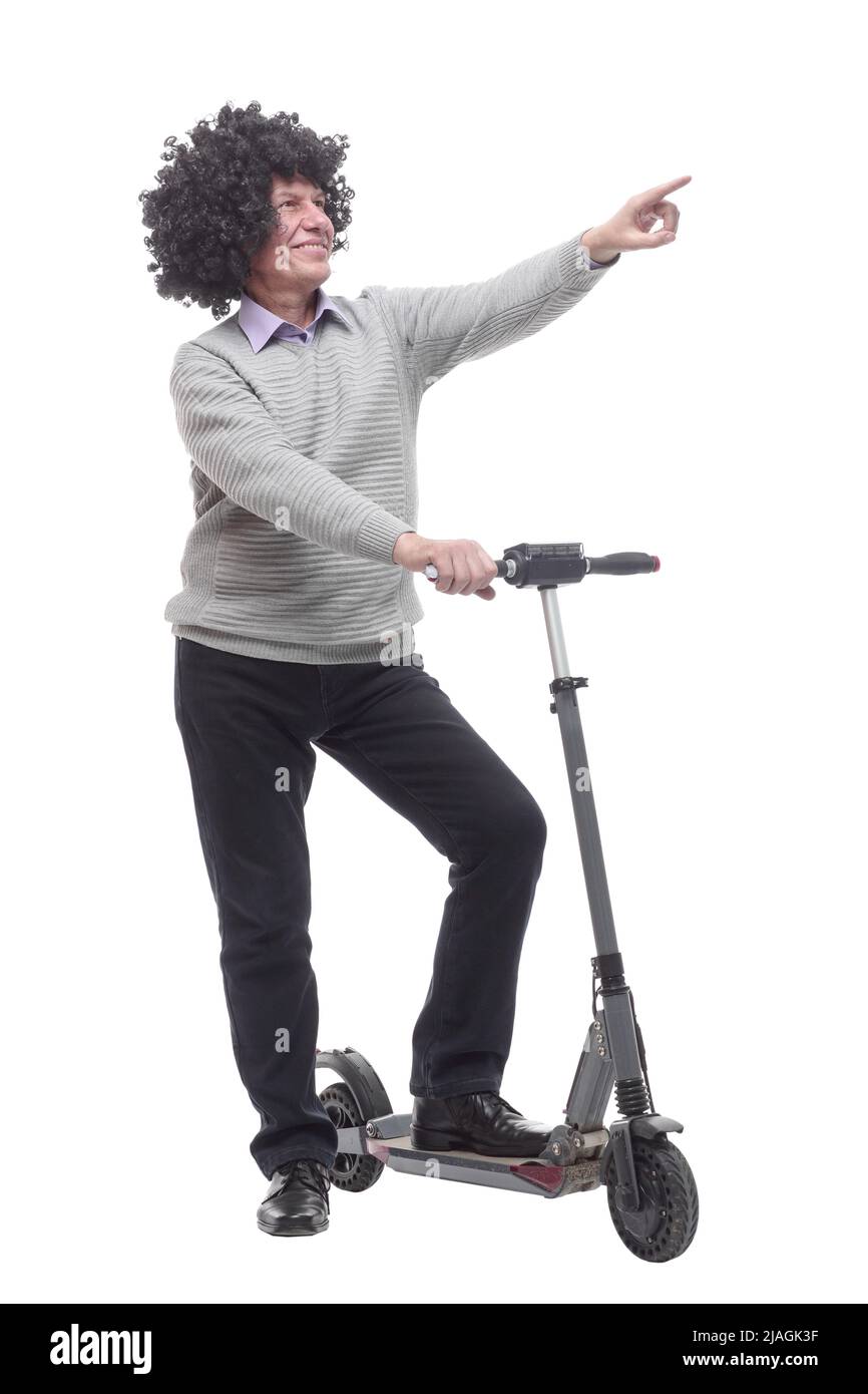 en pleine croissance. homme joyeux avec un scooter électrique. Banque D'Images