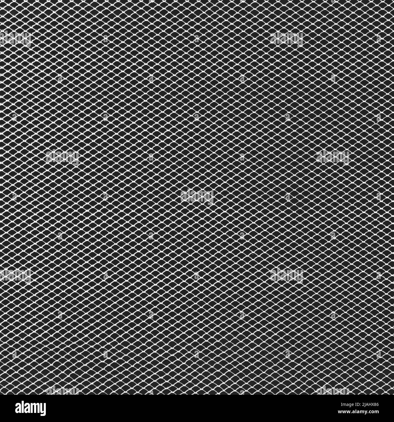 arrière-plan en grille métallique monochrome avec motif de points noirs. Banque D'Images