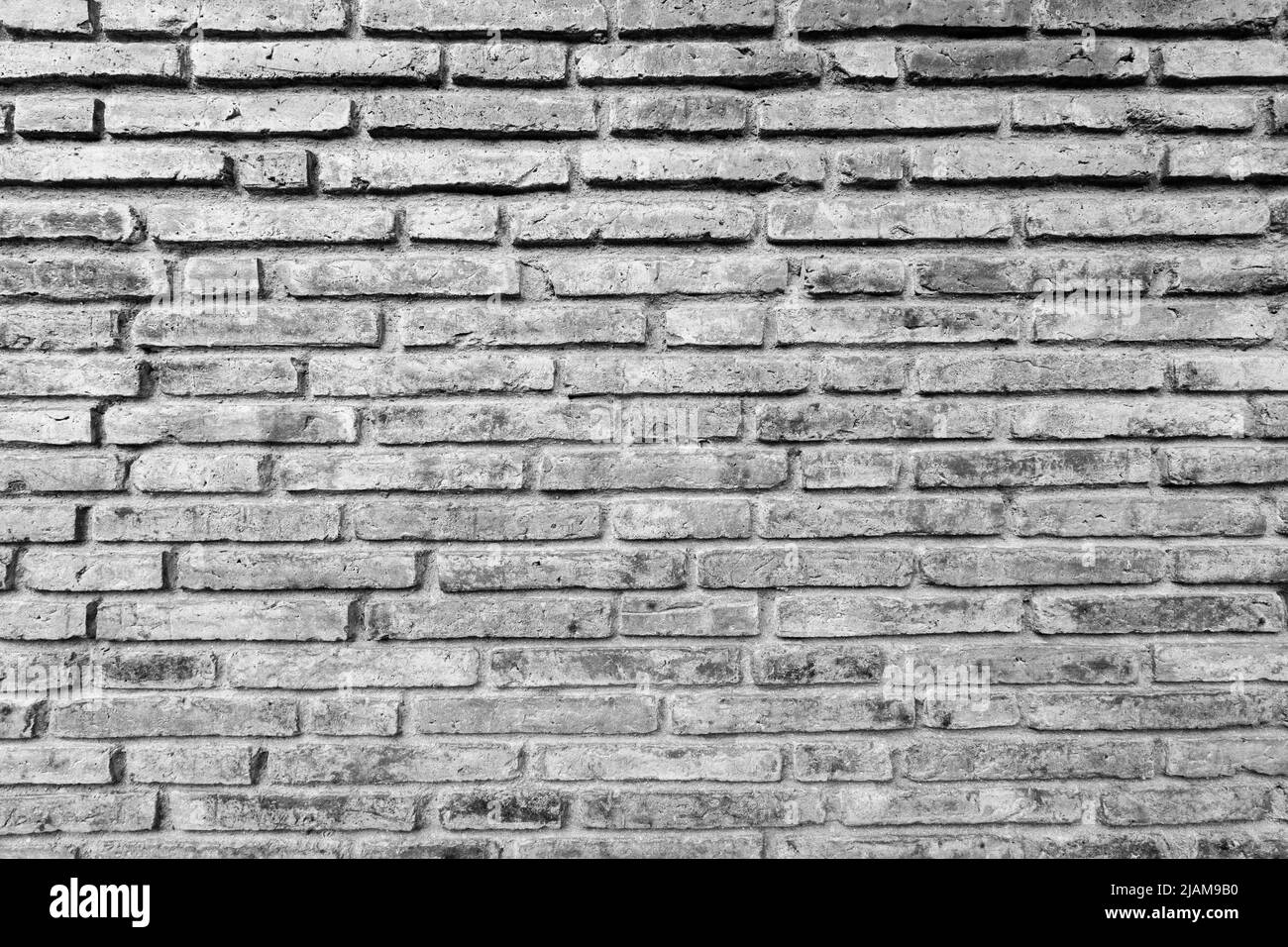 La texture de l'arrière-plan du mur de briques noir et blanc ancien se rapproche Banque D'Images La texture de l'arrière-plan du mur de briques noir et blanc ancien se rapproche Banque D'Images
