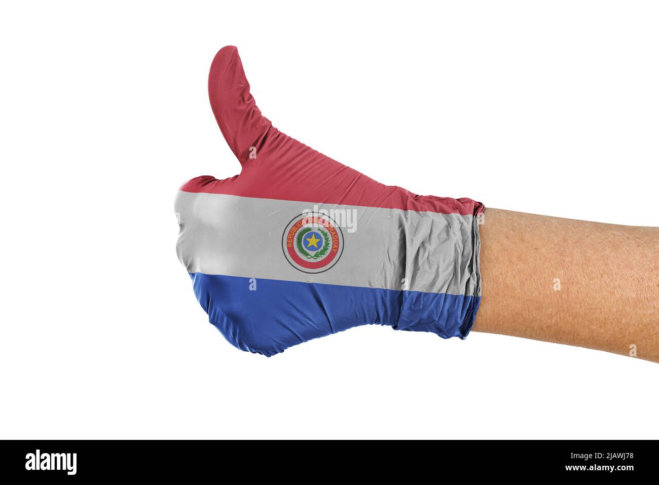 Drapeau du Paraguay sur un gant montrant un signe de pouce vers le haut Banque D'Images Drapeau du Paraguay sur un gant montrant un signe de pouce vers le haut Banque D'Images