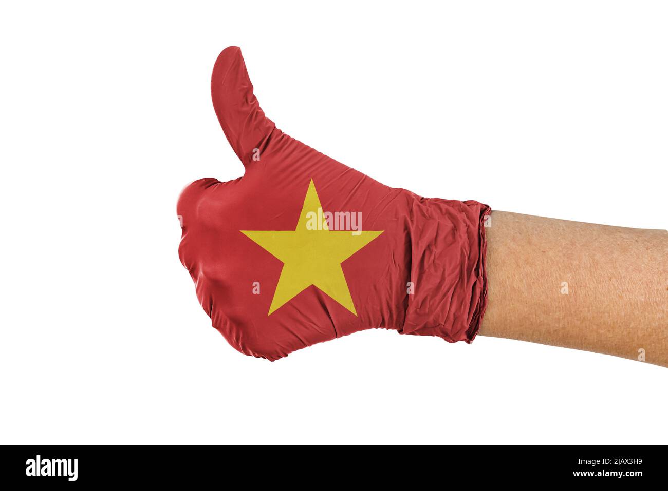Drapeau du Vietnam sur un gant médical montrant le signe du pouce vers le haut Banque D'Images Drapeau du Vietnam sur un gant médical montrant le signe du pouce vers le haut Banque D'Images