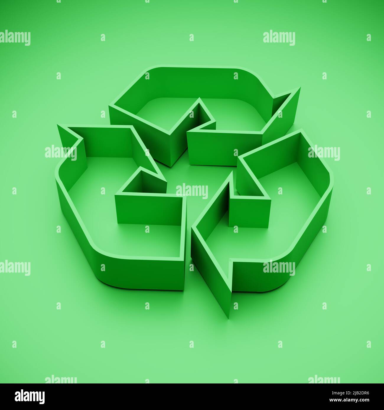 Logo de recyclage vert en 3D sur fond vert. Banque D'Images