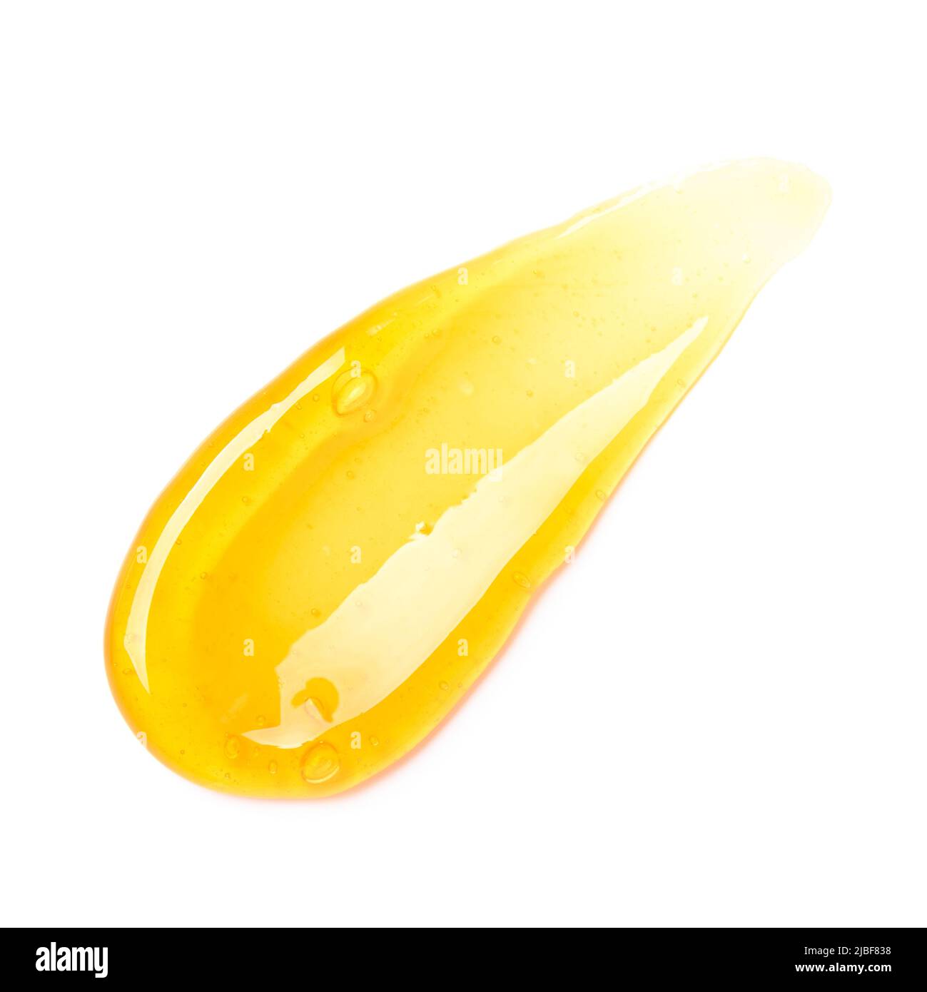 Frottis de gel orange transparent avec bulles isolées sur fond blanc vue de dessus Banque D'Images