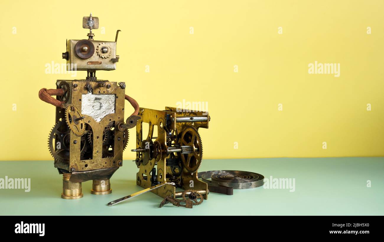 L'ancien robot répare le mécanisme et libère de l'espace. Banque D'Images