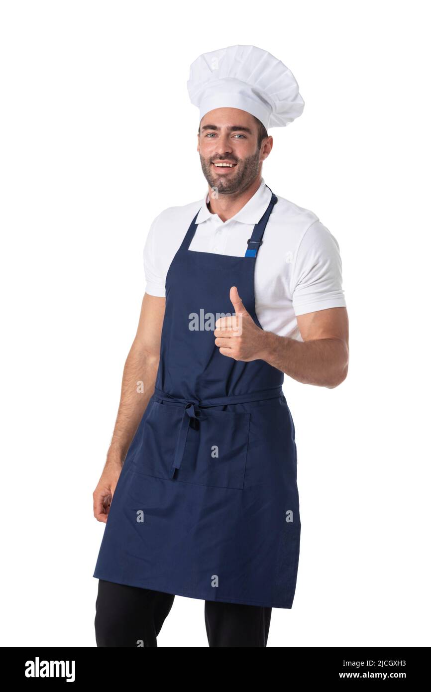 Portrait de Happy Young Cook en uniforme, isolé sur fond blanc. Regarder l'appareil photo montrant les pouces vers le haut. Banque D'Images