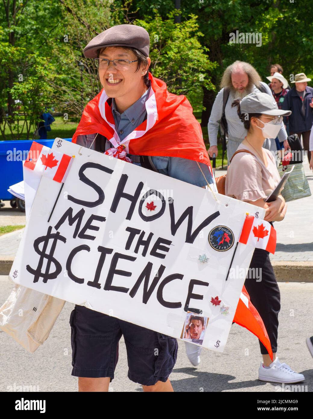 Un manifestant contre la vaccination possède un panneau intitulé « How Me the Science ». Il marche pendant le festival Word on the Street dans le Queen's Park CIR Banque D'Images