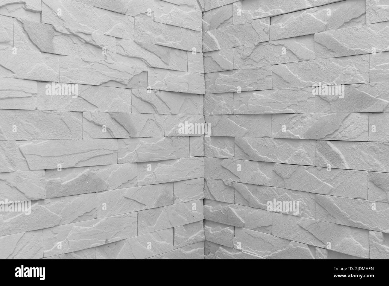 L'architecture en gros plan de fragments de briques d'angle du mur de couleur grise joint de l'arrière-plan de texture intérieure. Banque D'Images