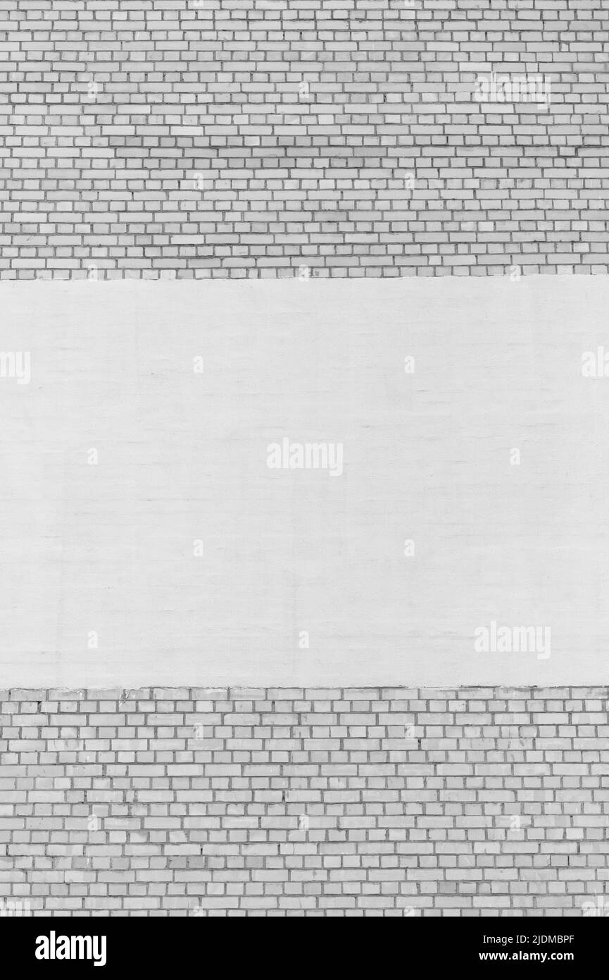 Façade de mur de briques extérieur d'un bâtiment urbain avec espace vide peinture objet de conception blanc échantillon de fond. Banque D'Images