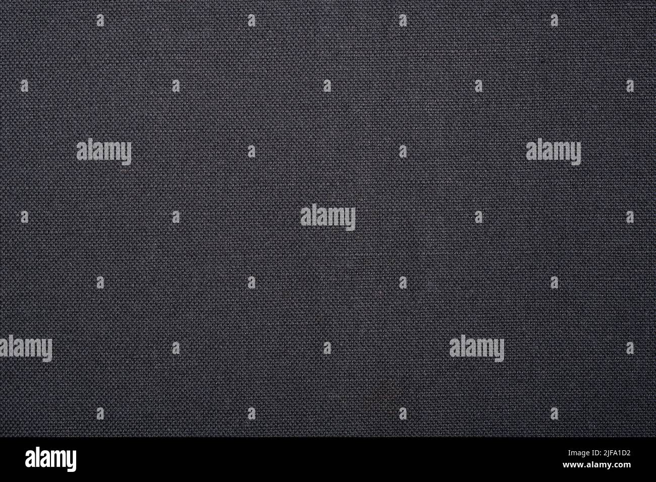 Arrière-plan en tissu texturé. Un fond plat gris Uni avec une surface texturée tissée. Banque D'Images