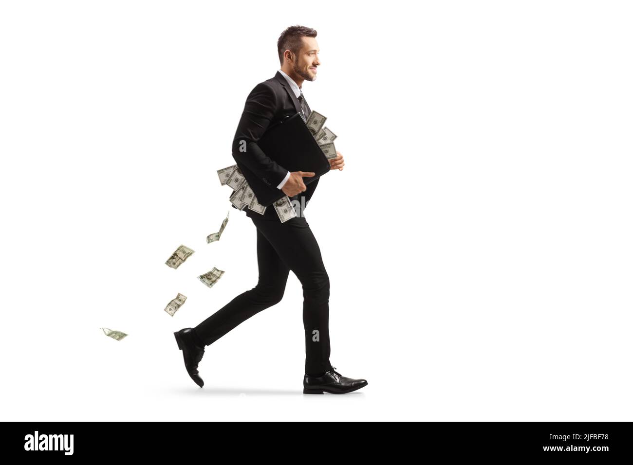 Photo pleine longueur d'un homme d'affaires courant avec un porte-documents plein d'argent isolé sur fond blanc Banque D'Images