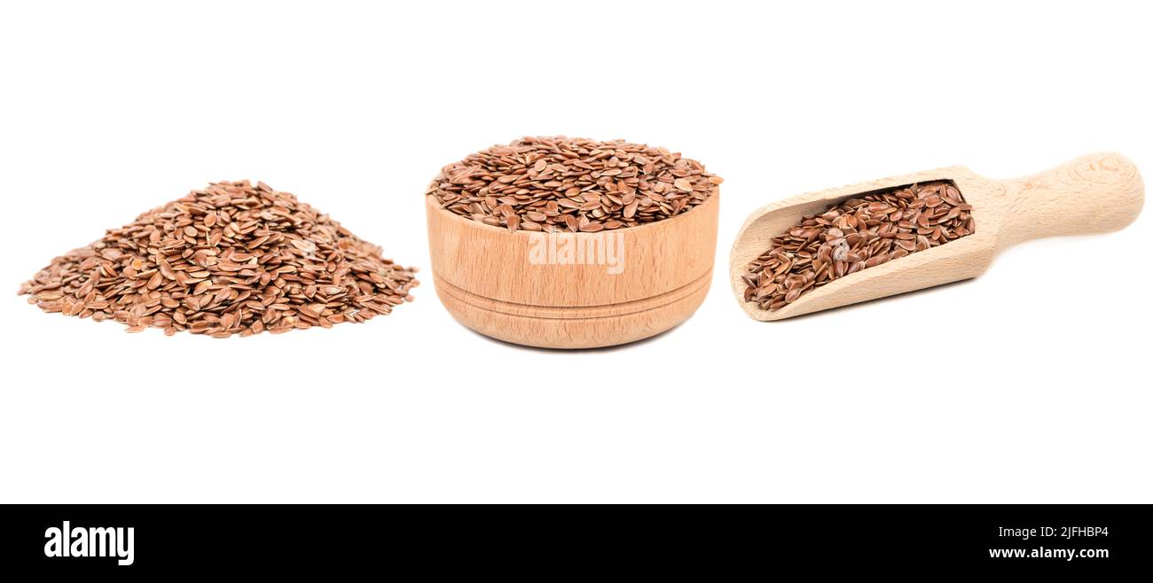 Sécher les graines de lin dans un bol et une pelle isolat sur fond blanc, collection Banque D'Images