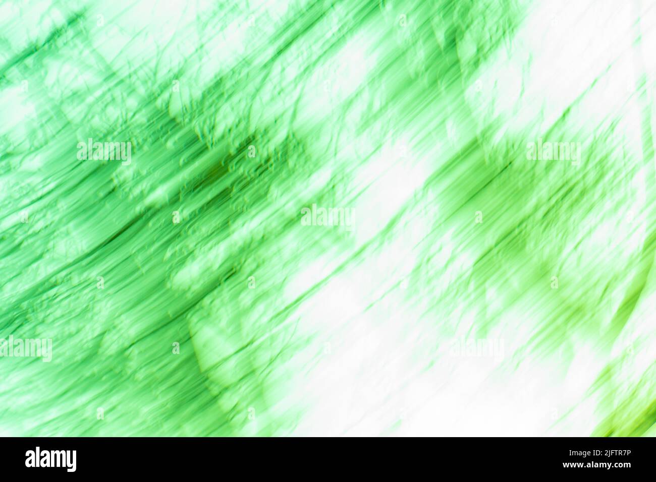 Effet bokeh flou de couleur pistache. Arrière-plan dégradé flou vert abstrait avec lumière. Banque D'Images