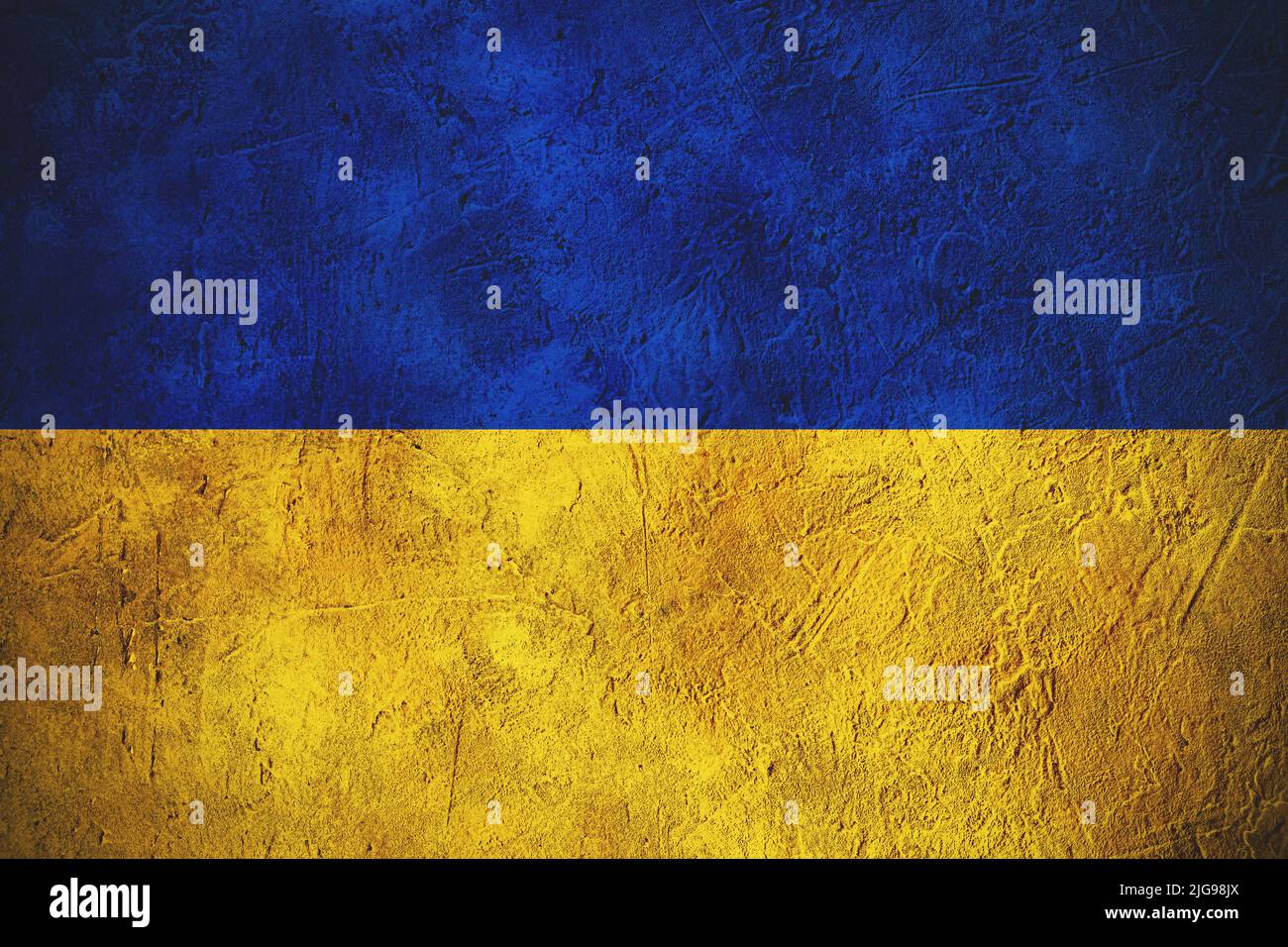 Le drapeau de l'Ukraine est vieilli avec un mur de béton de texture Banque D'Images