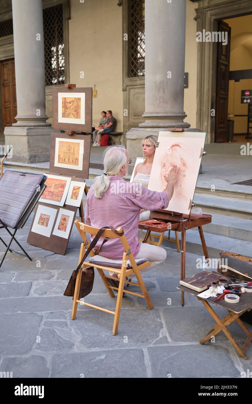 Peintre de portrait de rue à l'extérieur de la Galerie des Offices Florence Italie Banque D'Images