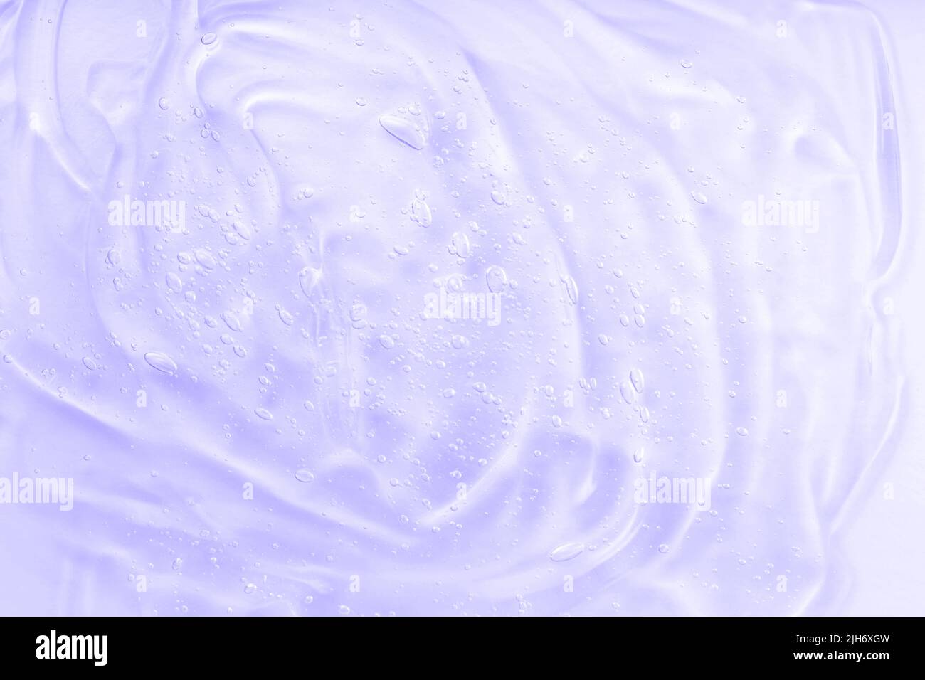 Texture de gel. Lotion pour la peau pour le visage, échantillon de sérum. Soins du corps. Acide hyaluron pour les soins de la peau avec le collagène. Crème cosmétique gel liquide transparent. Banque D'Images