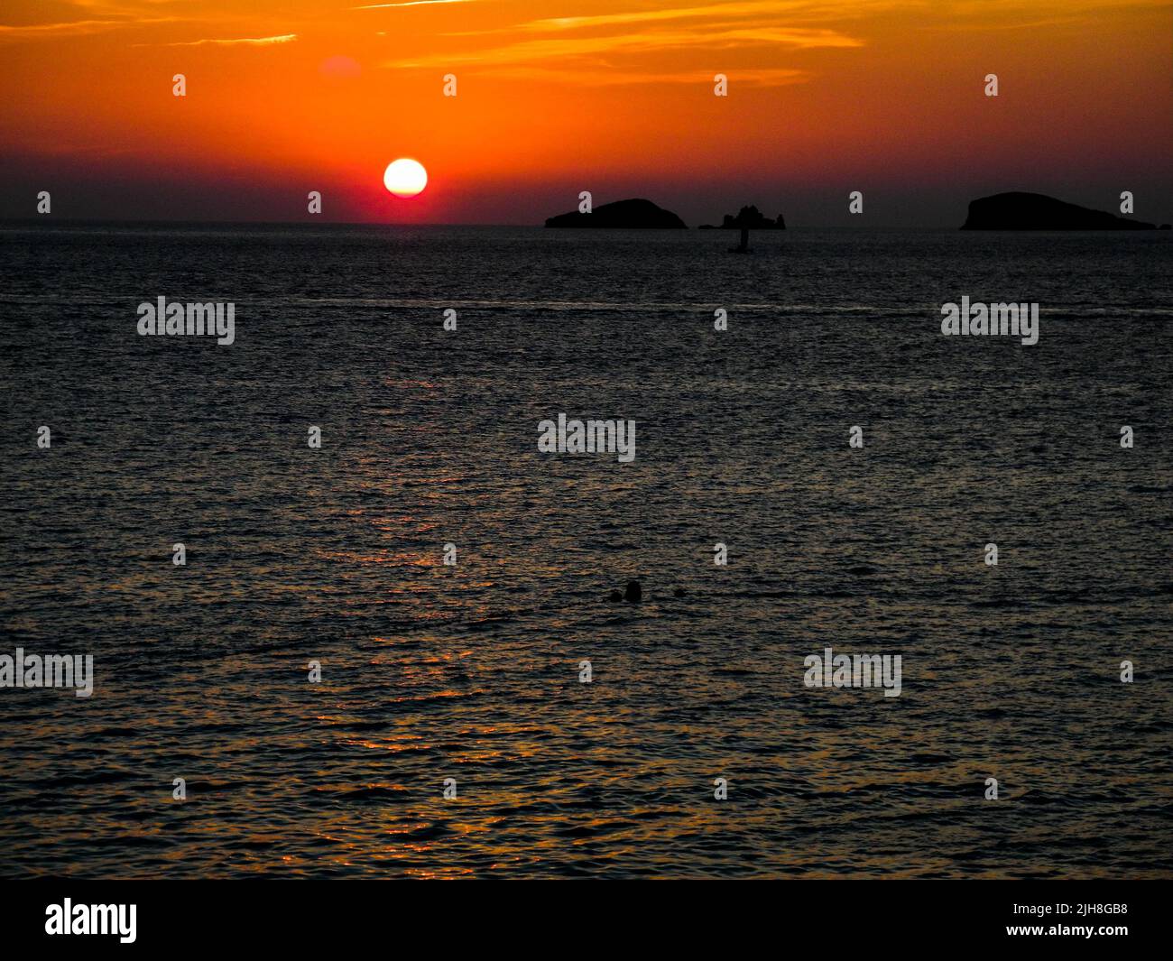 Coucher de soleil à Cala Conta, Ibiza, Espagne Banque D'Images