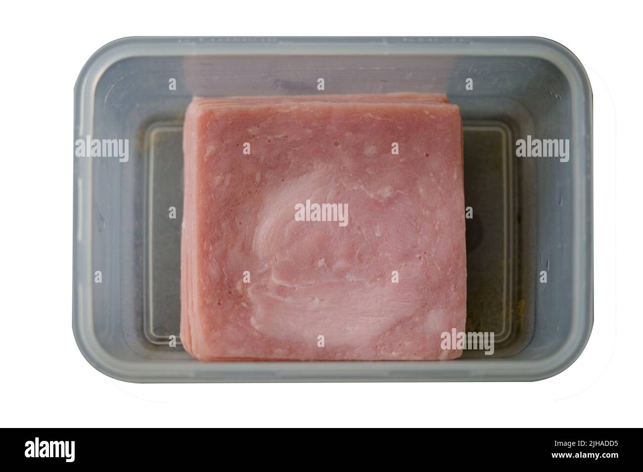 Tranches de jambon bouilli dans une boîte sur fond blanc Banque D'Images