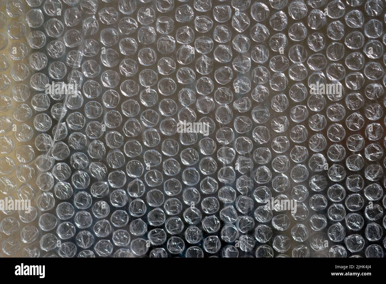 Gros plan de la bulle d'air. Texture de l'emballage à bulles. Matériau d'emballage de fond de texture. Le film protège la surface des chocs. Polyéthylène. Banque D'Images