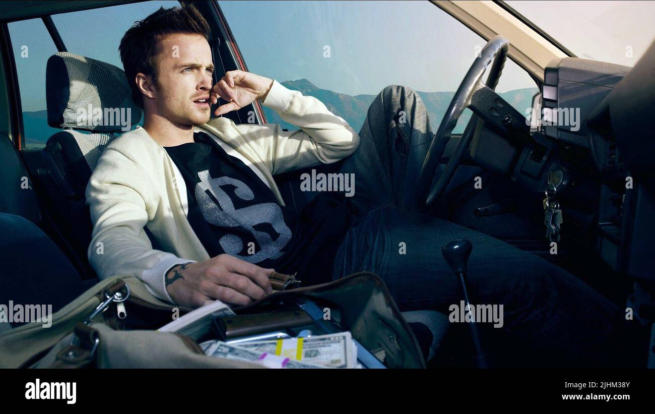 AARON PAUL, BESOIN DE VITESSE, 2014 Banque D'Images