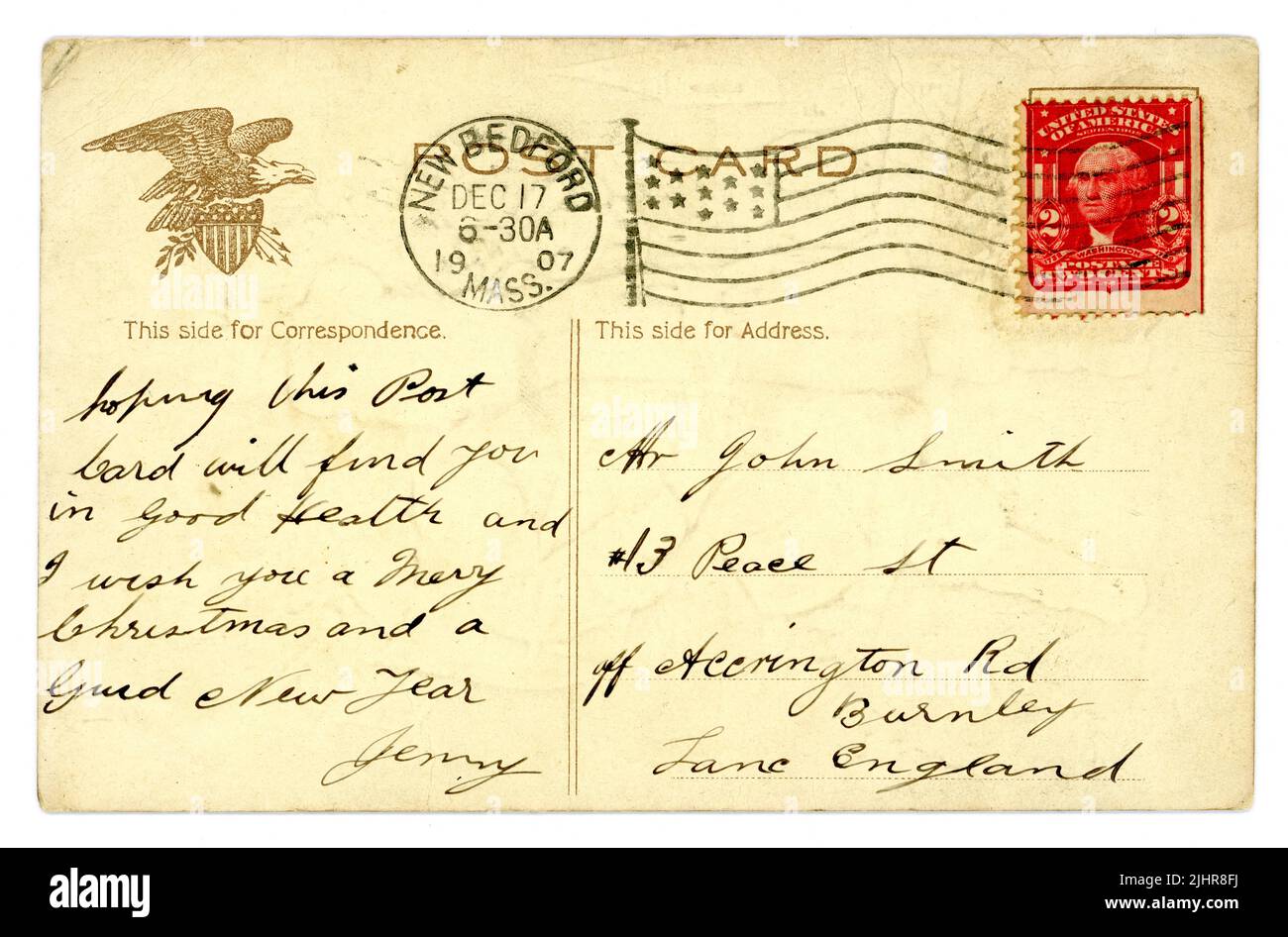 Inverse de l'époque édouardienne originale carte postale américaine de Noël, bon exemple de 2 cent George Washington timbre, avec des étoiles et des bandes drapeau, Eagle design, posté à une adresse en Angleterre, 17 décembre 1907. Banque D'Images