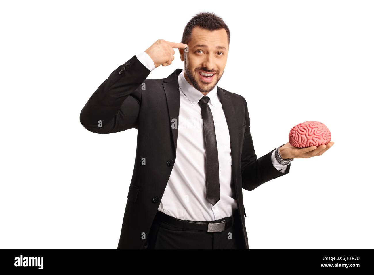 Homme d'affaires tenant un modèle de cerveau humain et pointant vers sa tête isolée sur fond blanc Banque D'Images