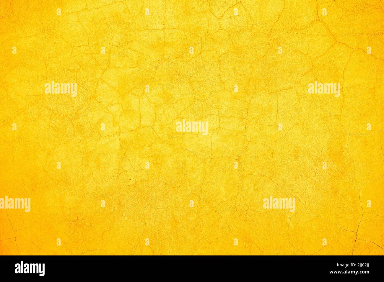 Abstrait rustique jaune et orange craquelé mur fond de conception de texture. Banque D'Images